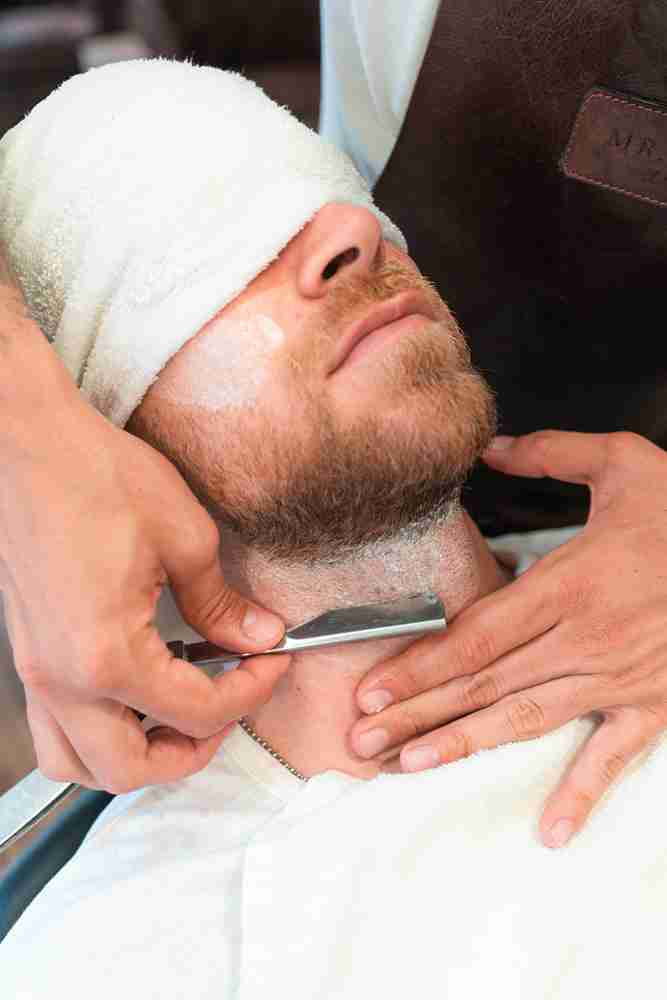 Expert King Fade haircut with sharp detailing at High Class Barber Shop.